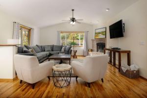 a living room with a couch and a table and chairs at Pinot Vista in Dundee