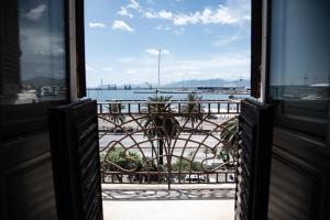 a view of the water from a balcony at Hotel AeR BJ Vittoria in Cagliari