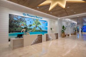 a lobby of a resort with a large sign on the wall at Margaritaville Vacation Club by Wyndham Nashville in Nashville