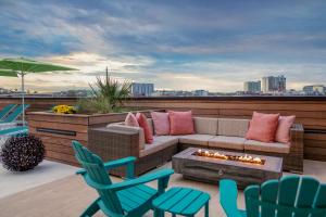 a patio with a couch and chairs and a fire pit at Margaritaville Vacation Club by Wyndham Nashville in Nashville
