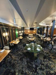a restaurant with tables and chairs in a room at Middle Park Hotel in Melbourne +16 photos