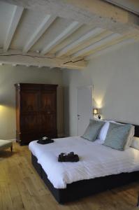 Postel nebo postele na pokoji v ubytování B&B 't Huys van Enaeme
