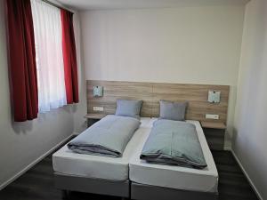 Katil atau katil-katil dalam bilik di Pension unterm Schlossturm