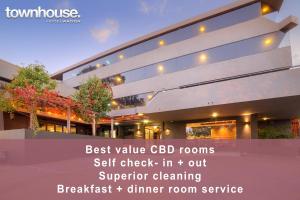 a building with the words best value cdb rooms self check in out superior at Townhouse Hotel in Wagga Wagga