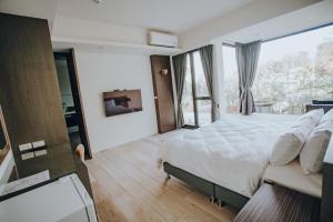 Postel nebo postele na pokoji v ubytování Ruili Tea Villa