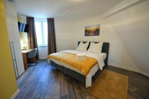 Ένα ή περισσότερα κρεβάτια σε δωμάτιο στο Boardinghouse am Welzbach