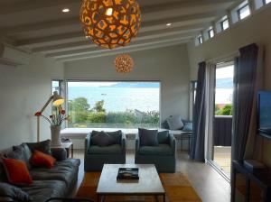 A seating area at Lakeview House - Taupo Holiday Home