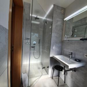 a bathroom with a sink and a shower at BB City Hotel in Böblingen