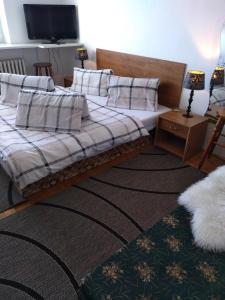 Posteľ alebo postele v izbe v ubytovaní Vysoké Tatry Gerlaška