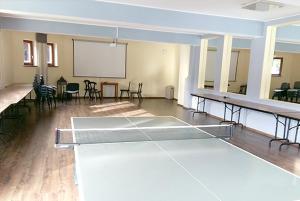 a large room with a table tennis court in it at Ośrodek Wypoczynkowo-Szkoleniowy HALNY in Zawoja