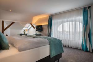 Postel nebo postele na pokoji v ubytování Holiday Inn - the niu, Rig Lübeck by IHG