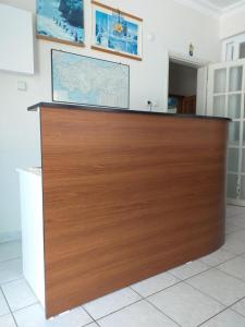 a large wooden reception desk in a room at Onur Pension in Fethiye