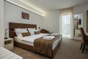 Ένα ή περισσότερα κρεβάτια σε δωμάτιο στο Hotel Rotondo