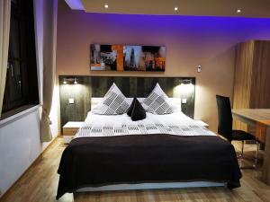 Postel nebo postele na pokoji v ubytování Apartmenthaus Wertheim