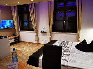 TV a/nebo společenská místnost v ubytování Apartmenthaus Wertheim