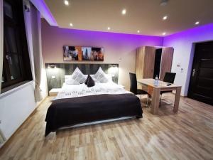 Postel nebo postele na pokoji v ubytování Apartmenthaus Wertheim