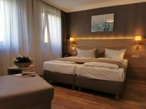 Postel nebo postele na pokoji v ubytování Hotel Cristal