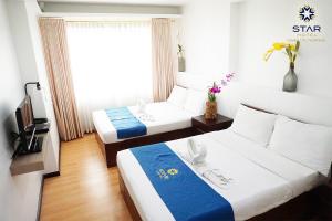 Postel nebo postele na pokoji v ubytování Star Hotel