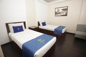 Postel nebo postele na pokoji v ubytování Star Hotel