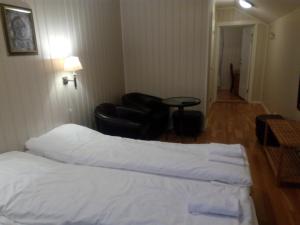 Postel nebo postele na pokoji v ubytování Dalselv hotell