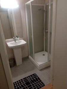a bathroom with a shower and a sink at Dalselv hotell in Stien