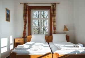 Postel nebo postele na pokoji v ubytování Hotel Večernice