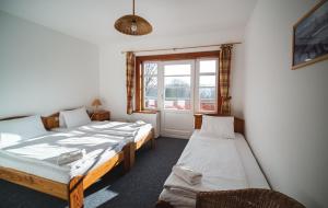 Postel nebo postele na pokoji v ubytování Hotel Večernice