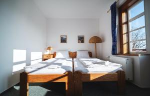 Postel nebo postele na pokoji v ubytování Hotel Večernice