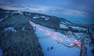 an aerial view of a ski slope at night at Royal Hill Residence in Zakopane