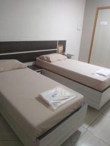 Letto o letti in una camera di Hotel Flex In