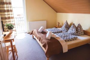 Postel nebo postele na pokoji v ubytování Pezión Limbový Dvor