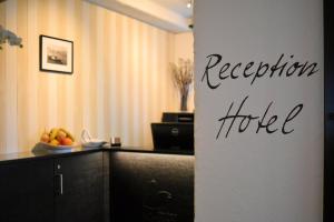 a kitchen with a counter with a bowl of fruit at Romantik Hotel Schwan in Horgen