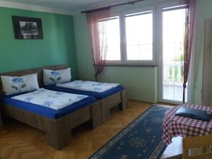 Łóżko lub łóżka w pokoju w obiekcie Smx Apartement