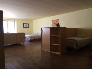 Postel nebo postele na pokoji v ubytování Mežupes