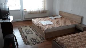 En eller flere senge i et værelse på Вила Багрянови
