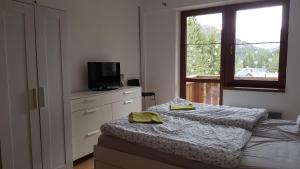 Posteľ alebo postele v izbe v ubytovaní Apartmány 33 a 8 AD Kamzík Donovaly