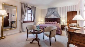 Postel nebo postele na pokoji v ubytování Hotel Hoffmeister