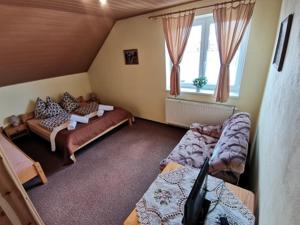 Postel nebo postele na pokoji v ubytování Pezión Limbový Dvor