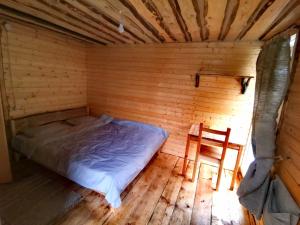 Postel nebo postele na pokoji v ubytování Ethno-Usadba