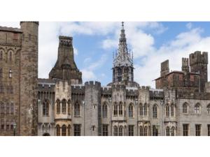 an old castle with a tower in the background at The Most Central Apartment in Cardiff in Cardiff