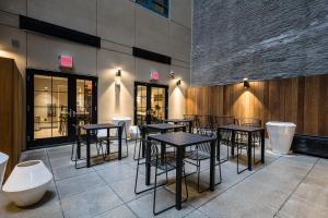 a group of tables and chairs in a restaurant at Pestana Park Avenue in New York