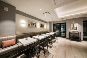 a row of tables and chairs in a restaurant at Pestana Park Avenue in New York