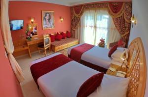 Postel nebo postele na pokoji v ubytování Oriental Rivoli Hotel & Spa