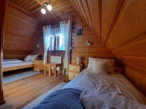 Postel nebo postele na pokoji v ubytování Pokoje Gościnne KAMI