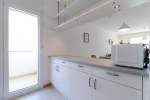 Kuchyň nebo kuchyňský kout v ubytování Nice apartment ideally located in Martigny + 21 fotografií