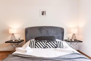 Giường trong phòng chung tại Nice apartment ideally located in Martigny