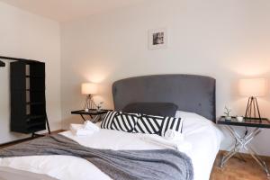 Giường trong phòng chung tại Nice apartment ideally located in Martigny