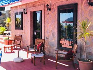 a patio with a bunch of chairs and tables at Estalagem Abrigo da Montanha in Monchique