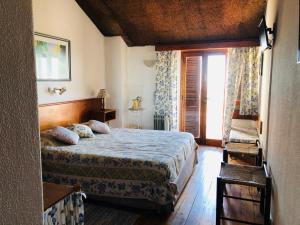 Postel nebo postele na pokoji v ubytování Estalagem Abrigo da Montanha