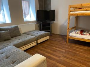 A bed or beds in a room at Virág Vendégház